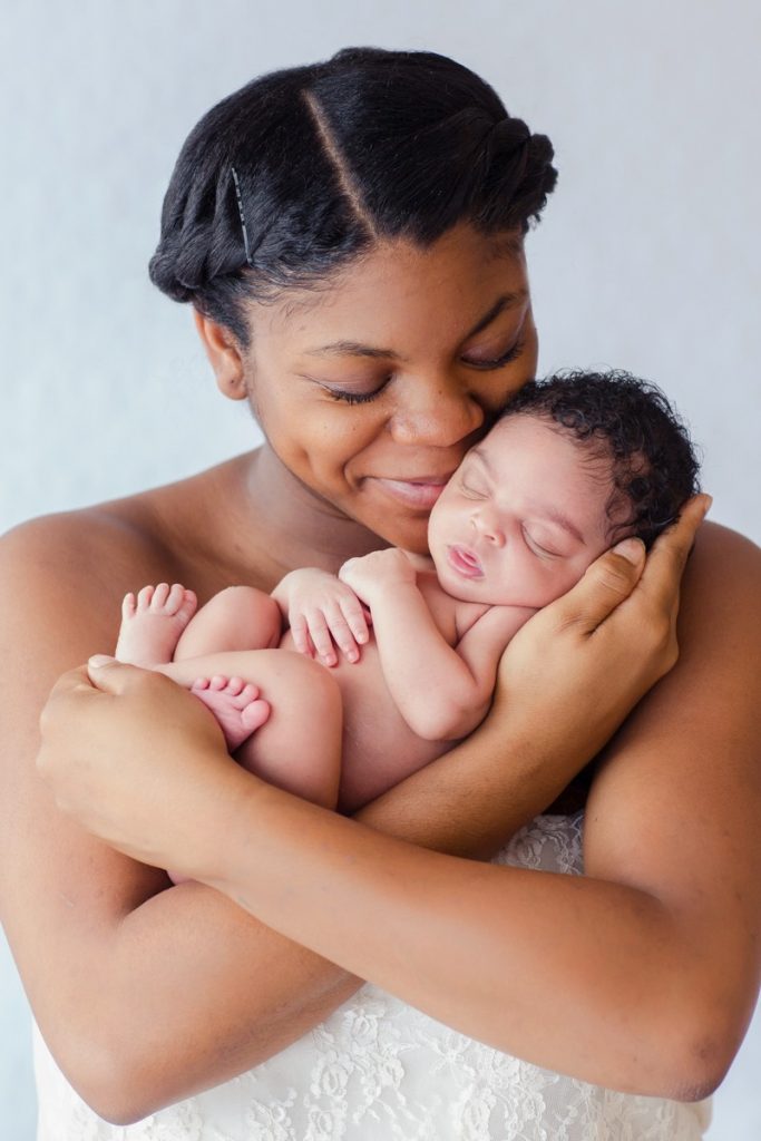 Mom and brand new baby nsuggle newborn photo Gainesville Florida