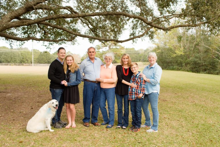 Family photos mom and dad with teen son and daughter at their home with grandparents