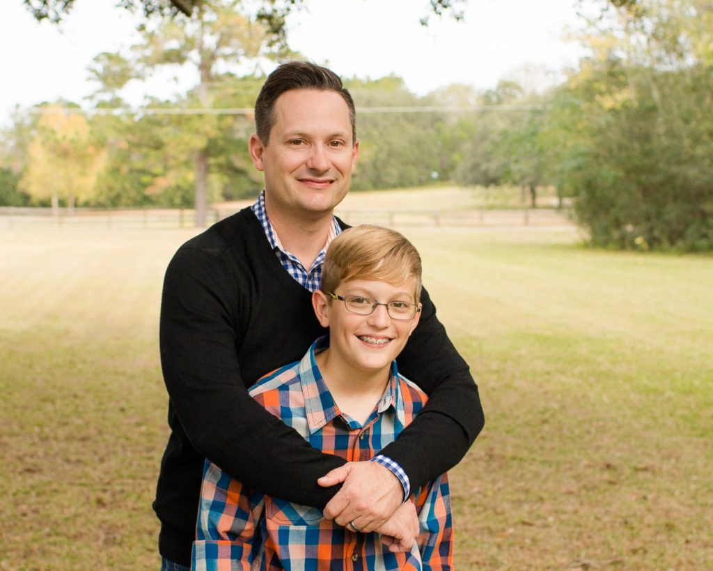 Family photos dad with teenage son at their home in sunshine