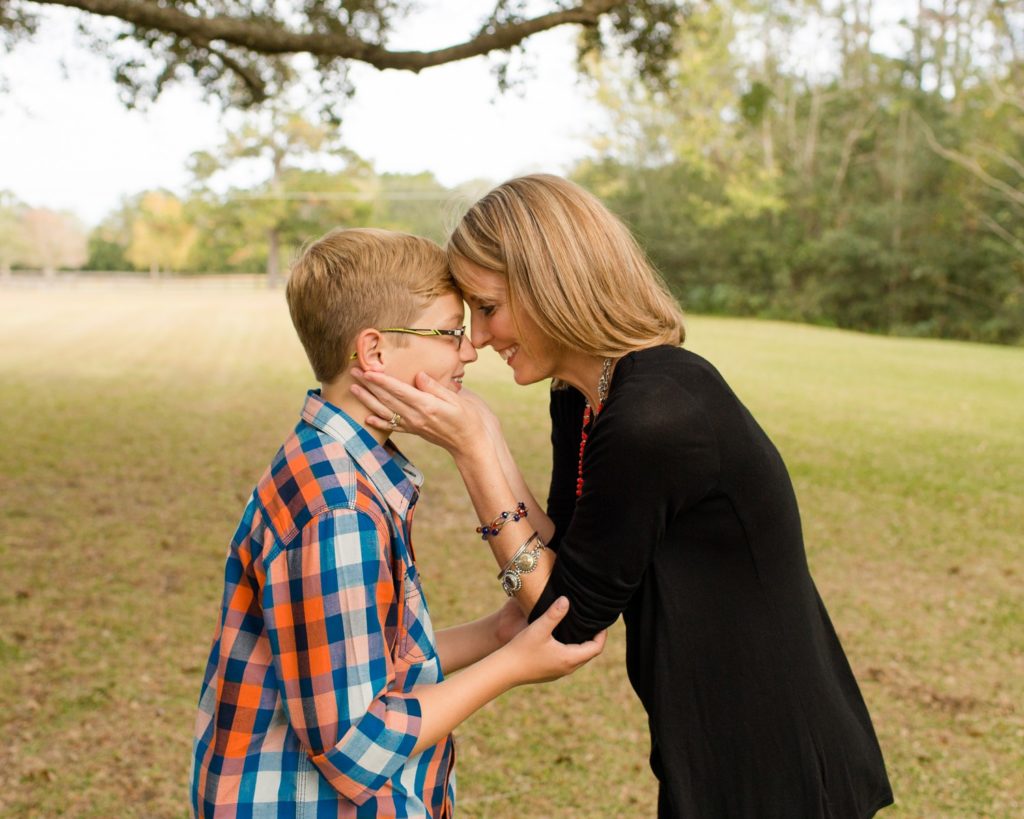 Family photos mom with teenage son at their home in sunshine