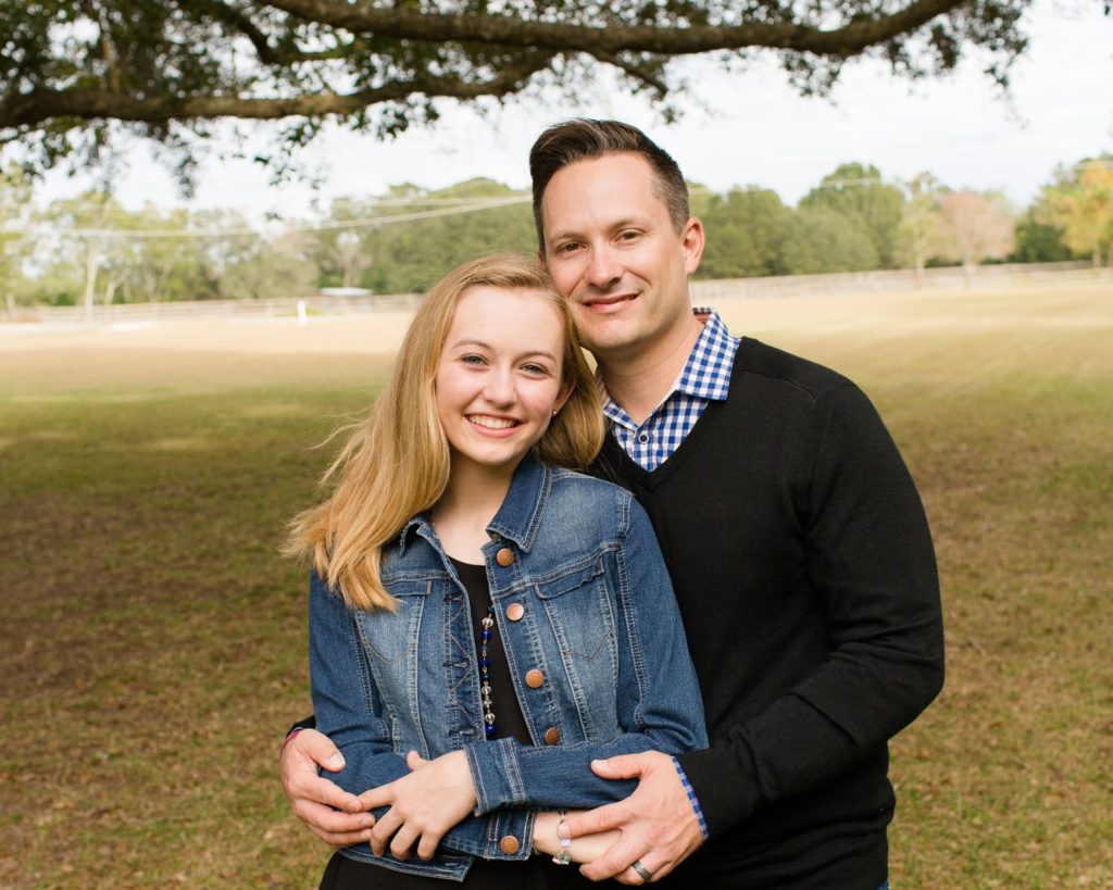 Family photos dad with teen daughter at their home in sunshine