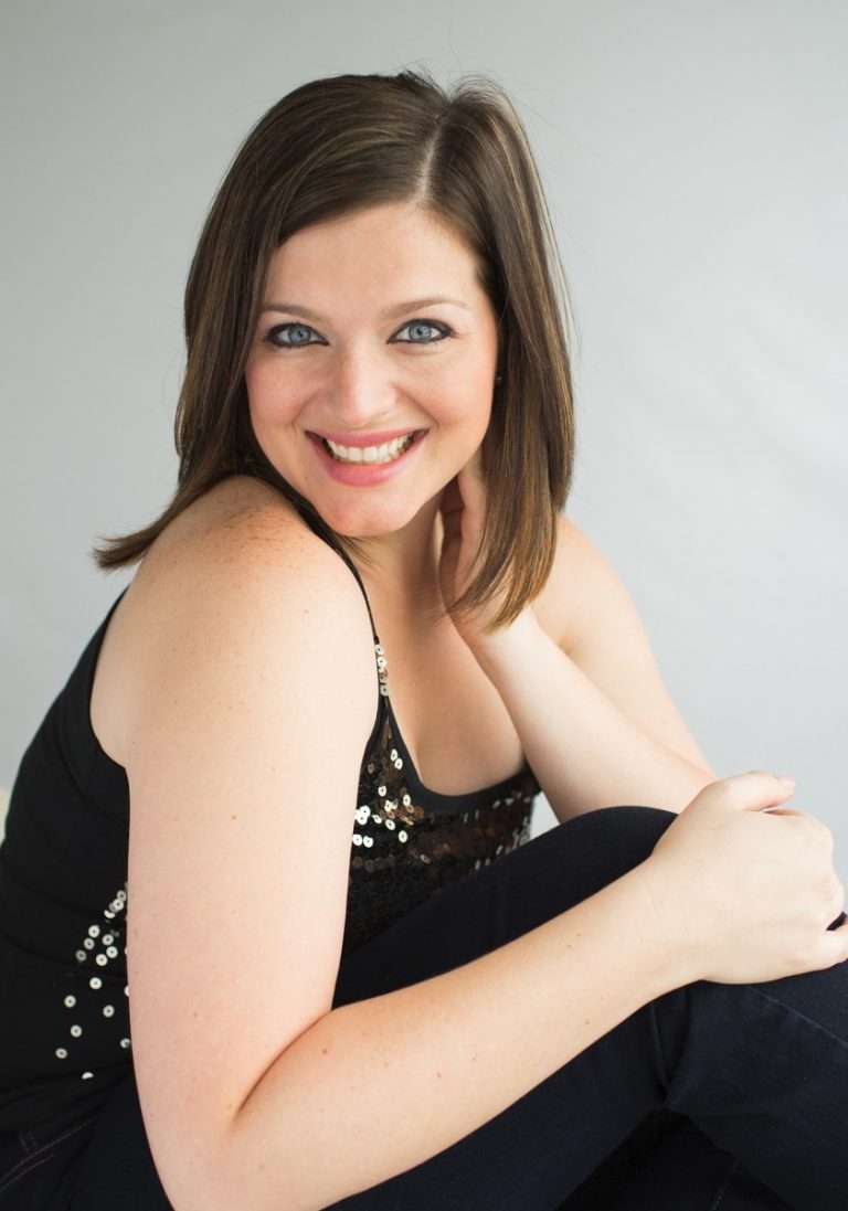 Gorgeous brunette woman brown eyes smiling over shoulder celebrates beauty glamor pose black sequin blouse Gainesville Florida Womens Portraiture