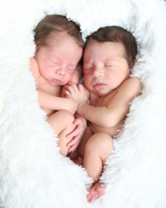 Newborn Twin Boys posed in heart shape taken in Gainesville, Florida