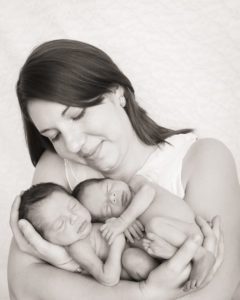 Newborn Twin Boys in Mom's Arms in Gainesville, Florida