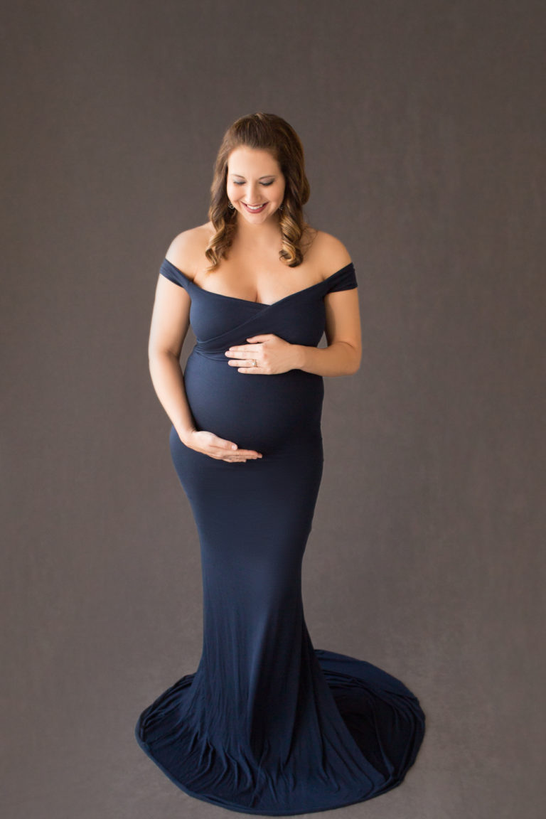 April with Maternity photos in navy gown carrying Twin girls in Gainesville Florida-1-2