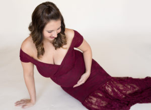 April with Maternity photos in burgundy lace gown carrying Twin girls in Gainesville Florida-14