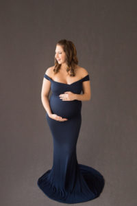 April with Maternity photos in navy gown carrying Twin girls in Gainesville Florida-17
