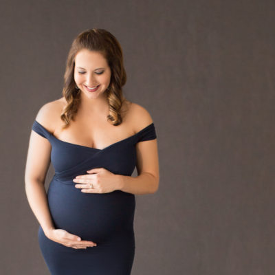 April in Maternity photos with navy gown carrying Twin girls in Gainesville Florida-18