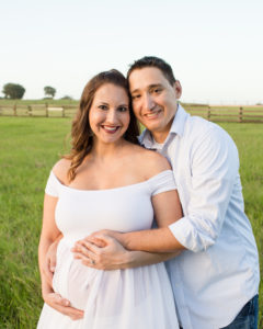 April and James outdoor Maternity photos carrying Twin girls in Gainesville Florida