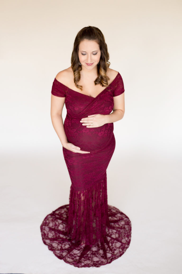 April with Maternity photos in burgundy lace gown carrying Twin girls in Gainesville Florida-6