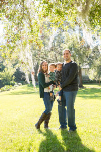 Family photo session at park with two year old twin boys