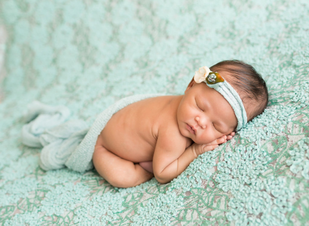Babygirl Newborn Photosession on Aqua Floral Baby Blanket with matching headband