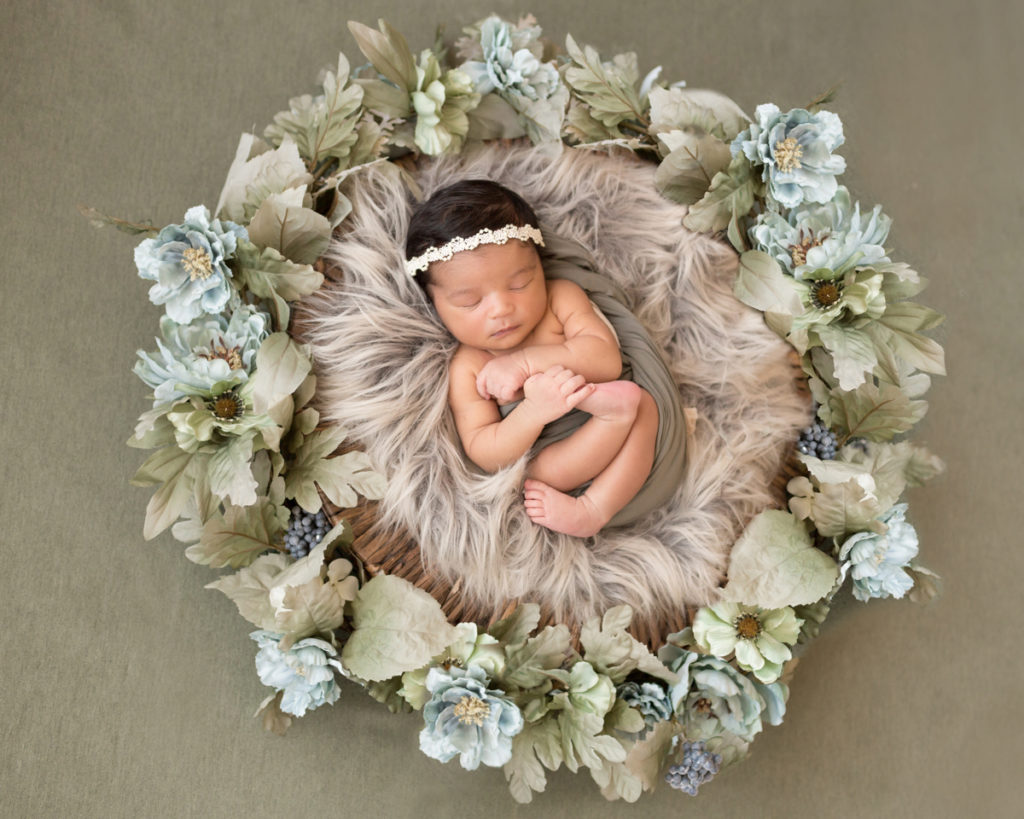 Newborn Girl with Green and Aqua Flower Basket Setup in Gainesville Florida