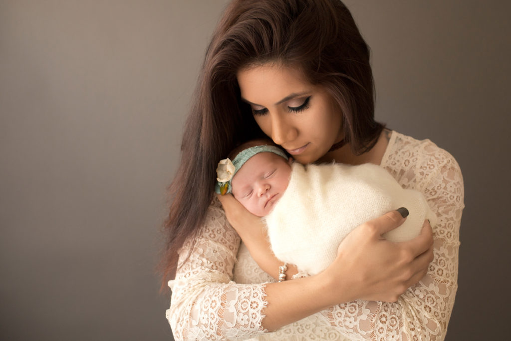 Baby girl Charleigh and Mom in lace cudding newborn in Gainesville Florida