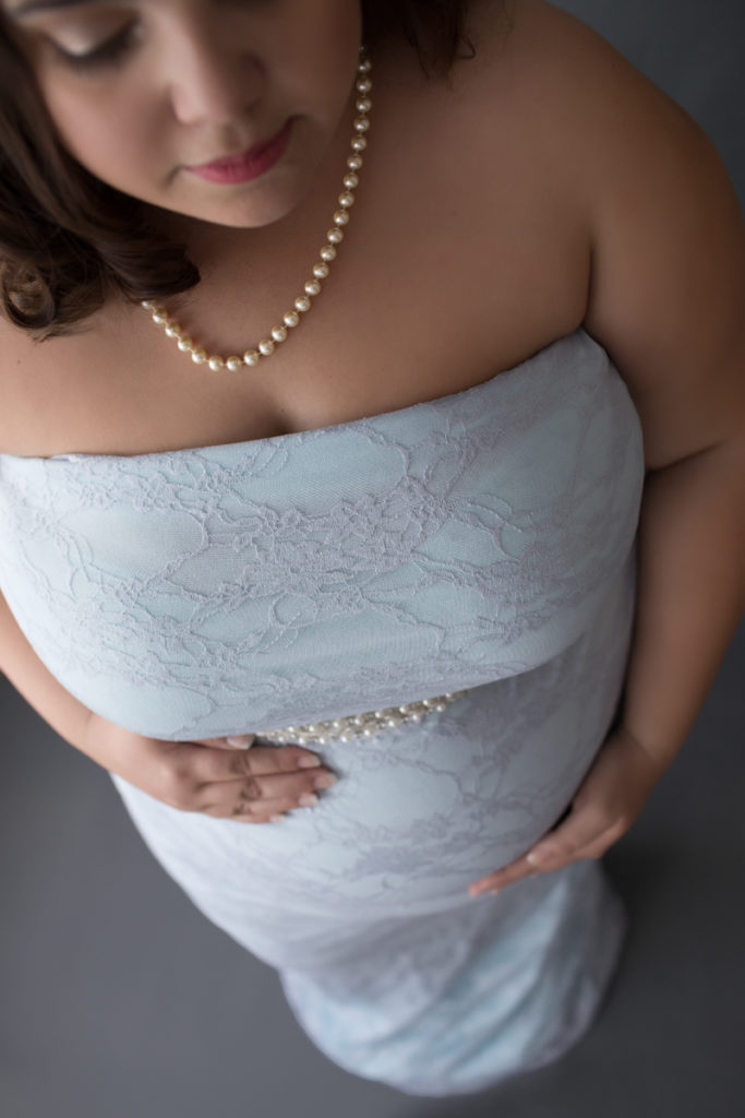 Elegant maternity photos of Pregnant Adelis in full length Blue Lace gown and Pearls in Alachua Florida