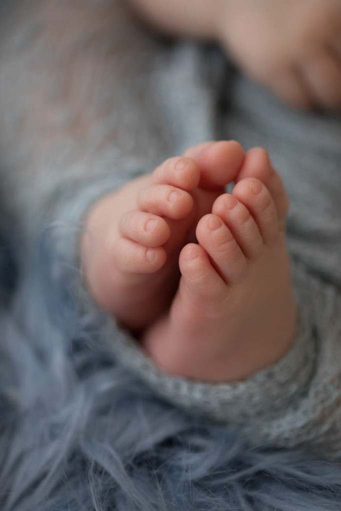 Baby newborn boy close up of toes and feet details in Gainesville Florida