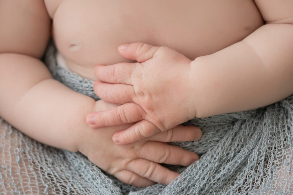 Baby newborn boy close up of hands and chunky arms in Gainesville Florida
