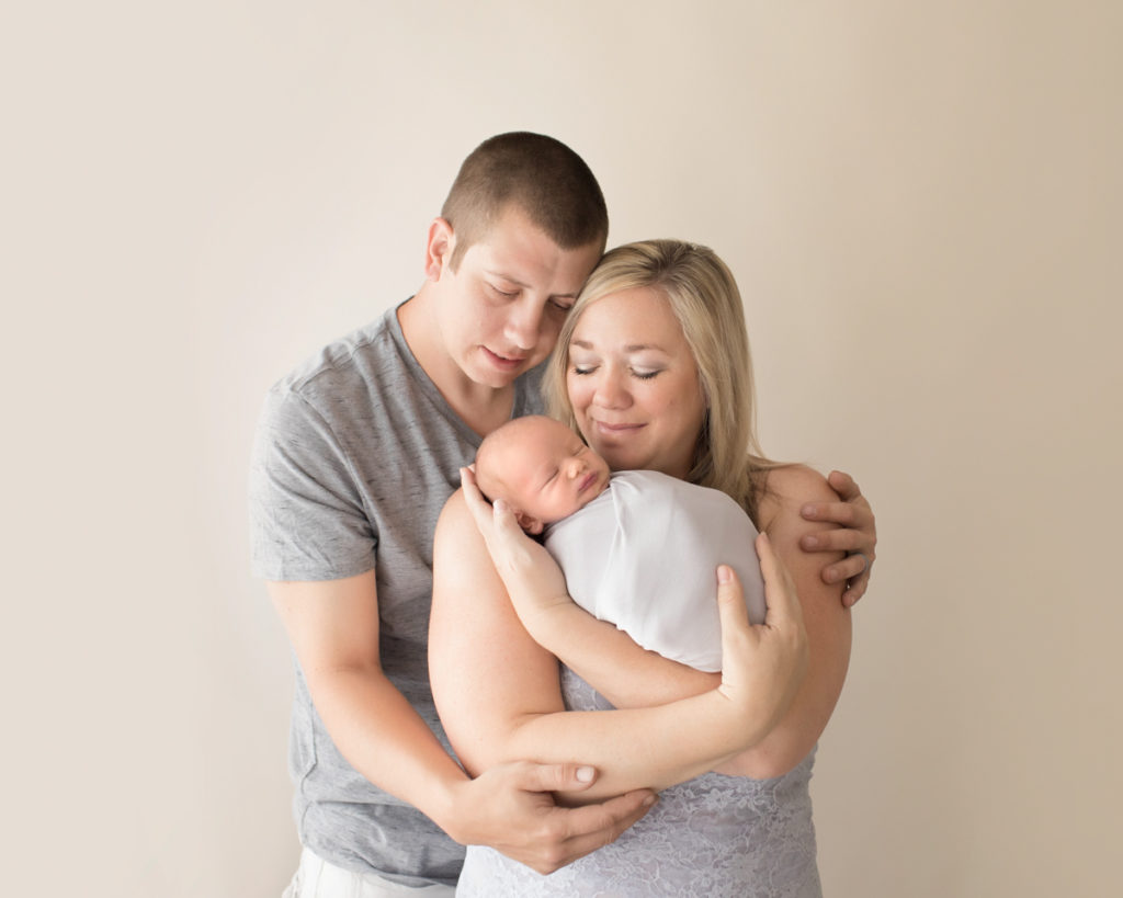 Parents photo mom dad and newborn baby grey and neutral colors