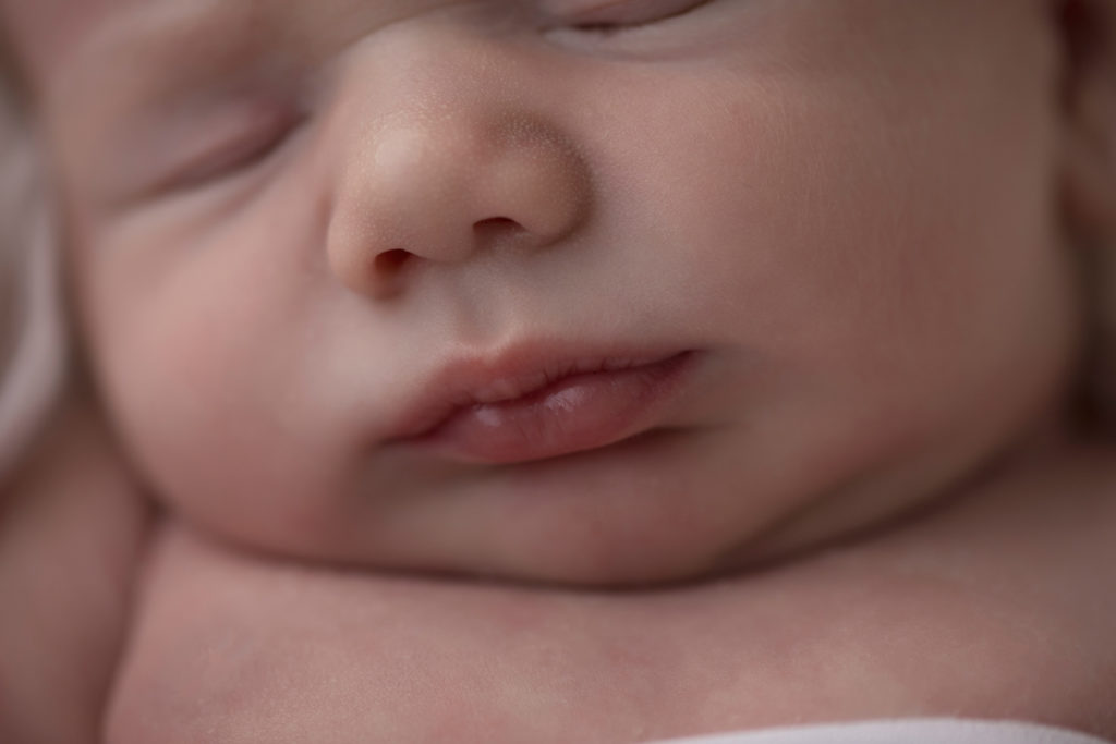 Naked baby newborn boy Chase close up of his face and gorgeous lips in Gainesville Florida