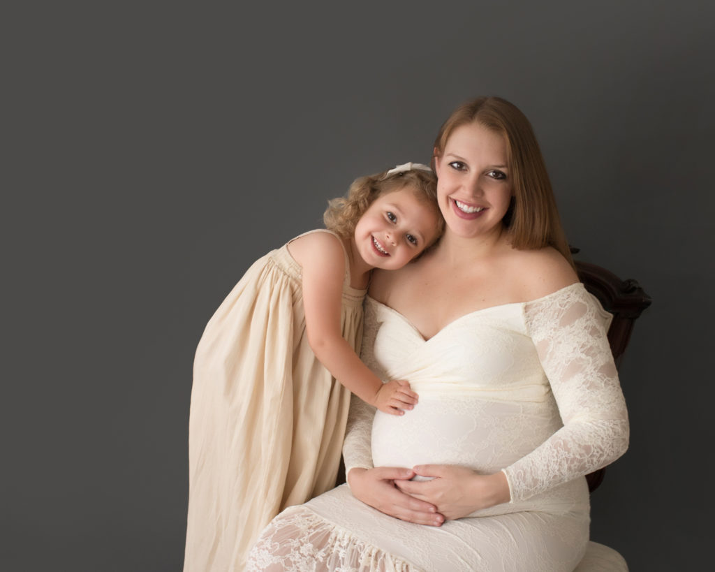 Morgan and daughter Sydney dressed in coordinating gowns for maternity photos