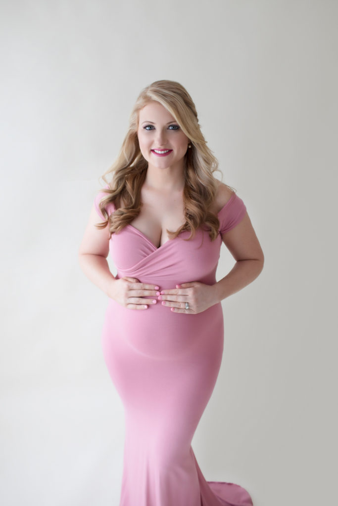 Maternity photos Christina fashion posed as cover girl wearing mermaid style full length rose pink gown Gainesville Florida