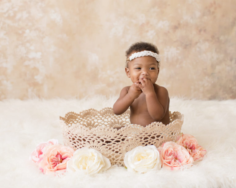 Adorable Rose One Year Old in lace basket with pink and white flowersBaby Girl Photos Gainesville Florida