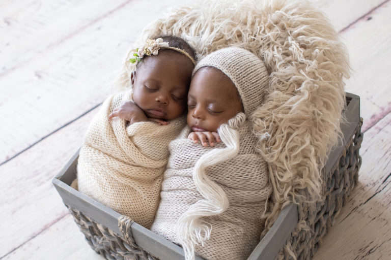 Twin Newborns Samuel and Sophia matching potato sack beige knit wraps bonnet in fur stuffed basket Gainesville Florida newborn photos