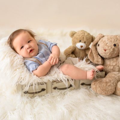 3 month baby pictures khaki shorts button up collared shirt suspenders teddy bear mom's stuffed bunny little baby grin