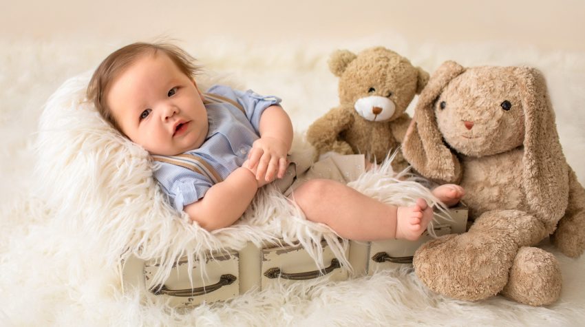 3 month baby pictures khaki shorts button up collared shirt suspenders teddy bear mom's stuffed bunny little baby grin