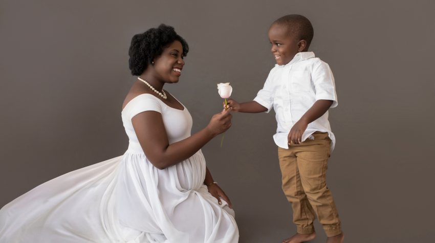 maternity portrait boy hands pink rose to mom for baby sister white chiffon maternity gown Gainesville FL