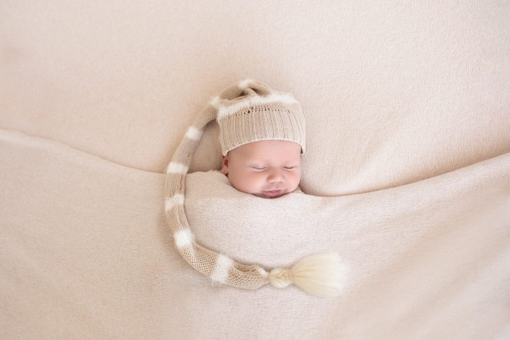 newborn photo with hat