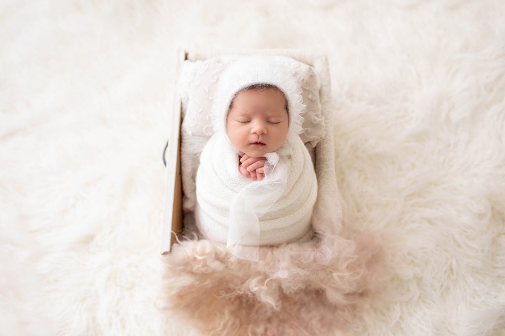 newborn baby with props