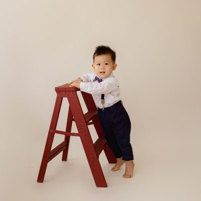 One Year Milestone Photos for Baby Boy Climbing and Exploring