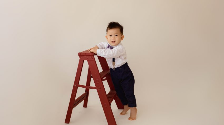 One Year Milestone Photos for Baby Boy Climbing and Exploring