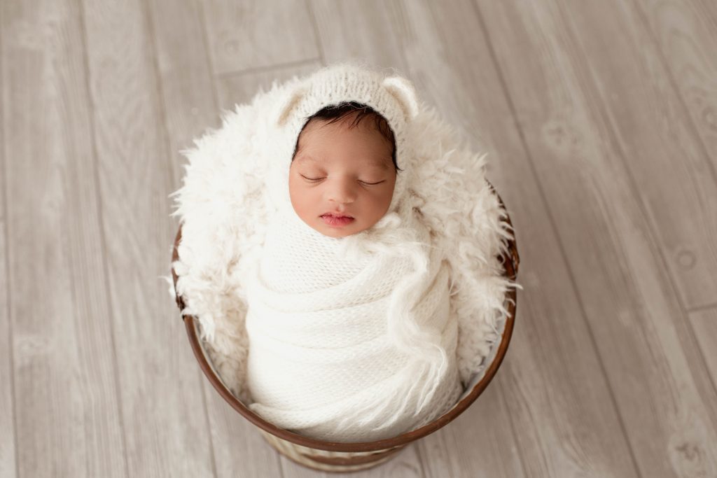 Newborn Baby Boy Swaddled in Basket in Gainesville, FL