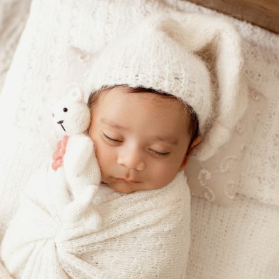 Andrea Sollenberger Professional Newborn Photographer Newborn sleeping with Teddy Bear