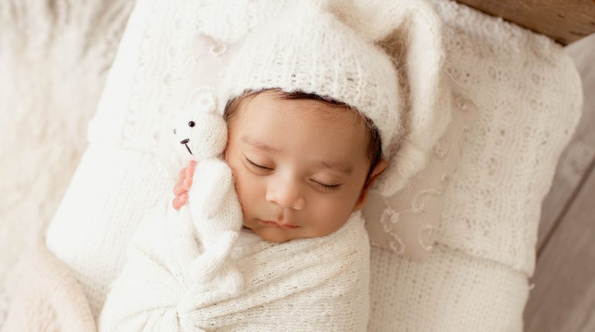 Andrea Sollenberger Professional Newborn Photographer Newborn sleeping with Teddy Bear