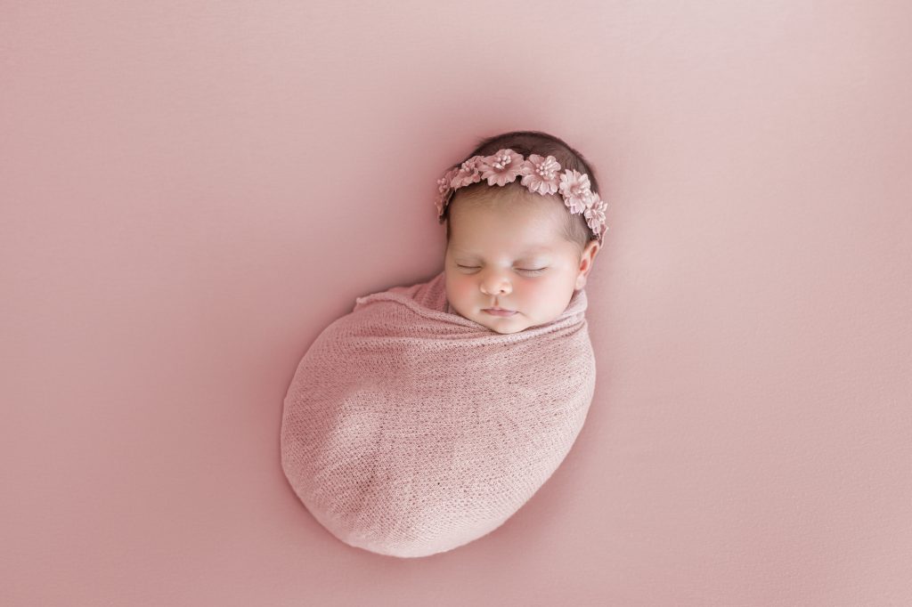 Newborn Baby Girl Swaddled in Pink