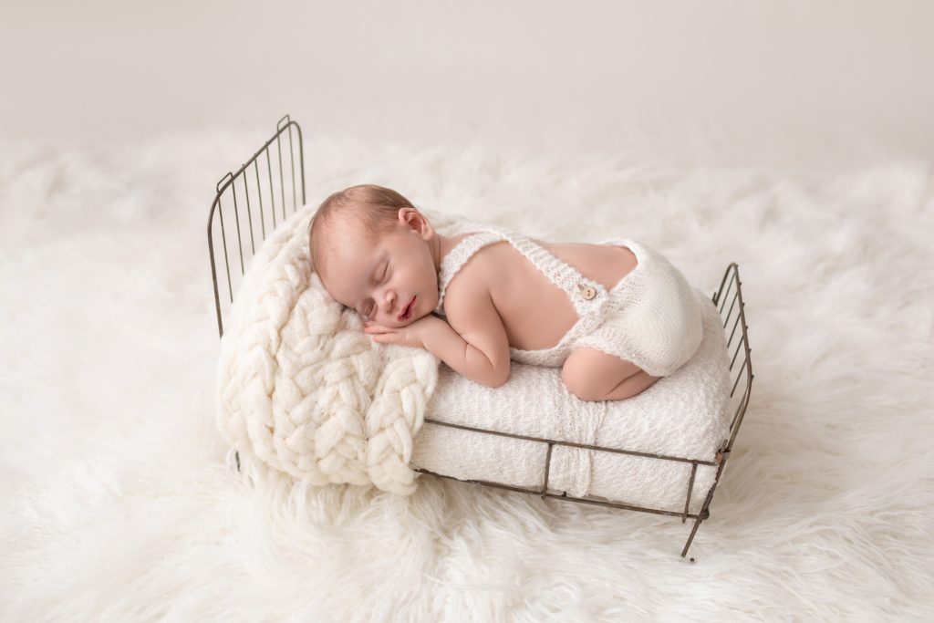 Newborn Baby Sleeping in Brass Bed Professional Portraits